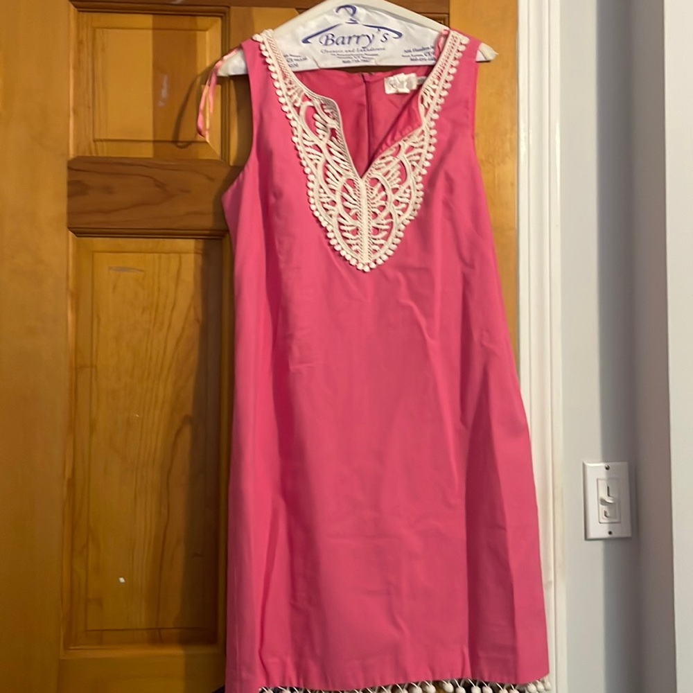 Pink sleeveless linen dress with lace around the neck